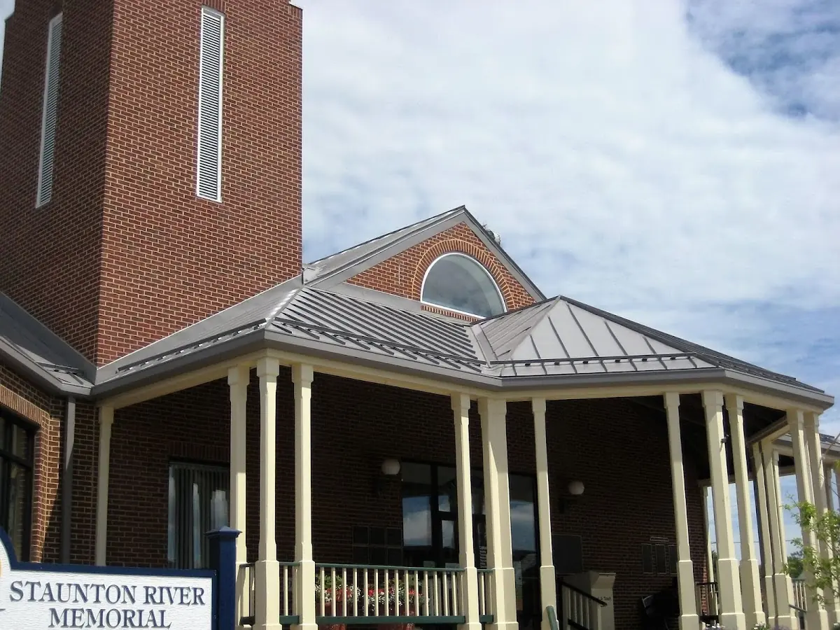 Skilled roofing craftsmen working on a residential roof in Berea